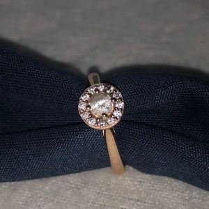 White sapphire and diamond halo ring in 9k rose gold